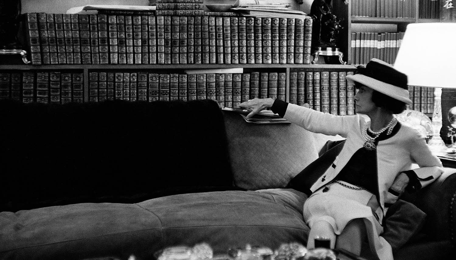 Coco Chanel in the library of her own home
